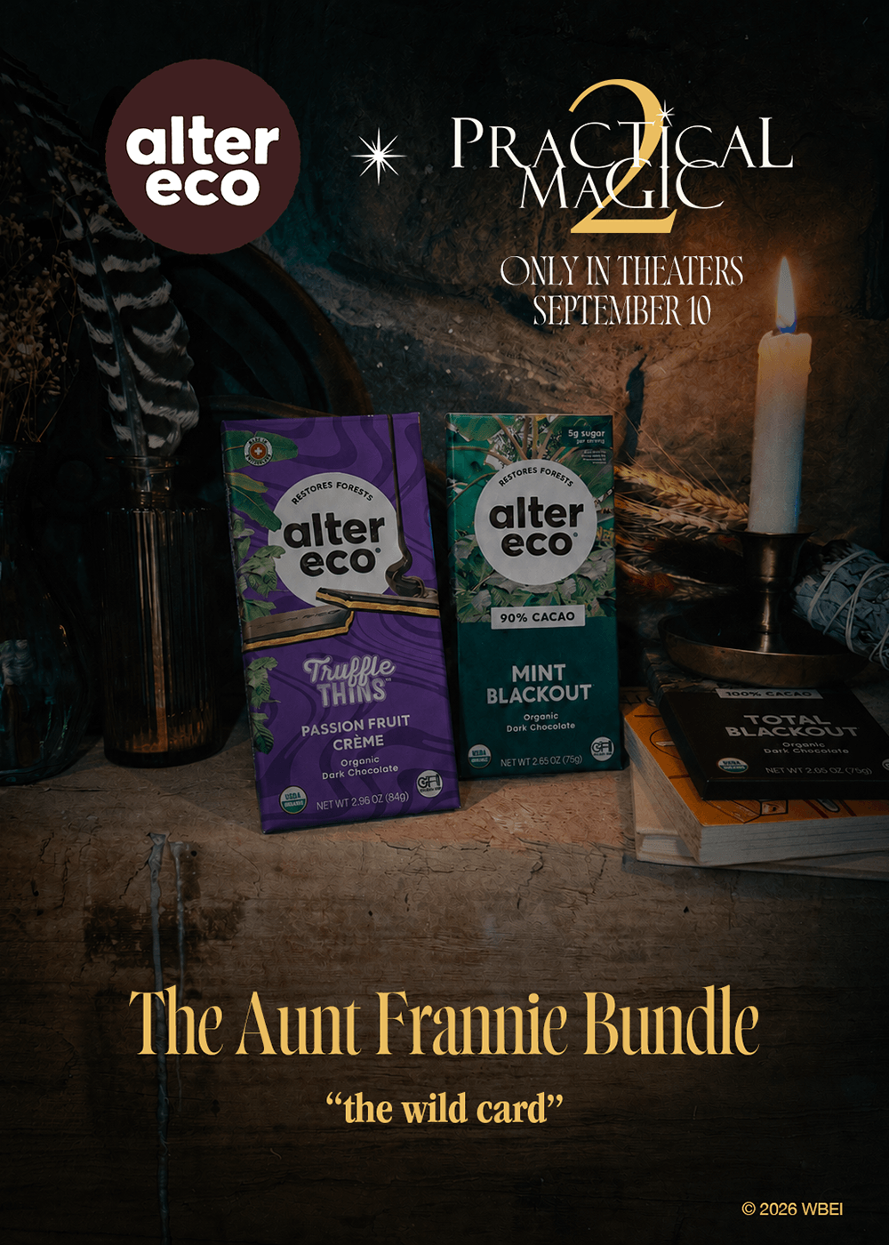 Two Alter Eco candy boxes displayed on a rustic wooden surface with a candle, books, and dark decorative background. Text at the top reads 'alter eco' and 'Practical Magic 2 Only in Theaters September 14,' and text at the bottom reads 'The Aunt Frannie Bundle "the wild card".
